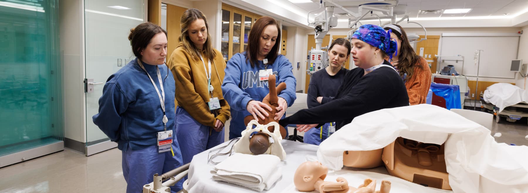 Dr. Amber Shiflett, Associate Professor, is teaching residents about shoulder dystocia in resident simulation.